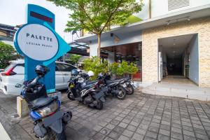a group of motorcycles parked in front of a hotel at Palette Legian Beach in Legian +103 photos