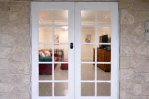 a sliding glass door in a living room at Kookaburra Guesthouse in Coffs Harbour