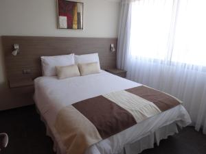 Postel nebo postele na pokoji v ubytování Tempora Apart Hotel
