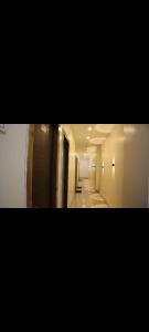 a view of a hallway in a building at Tokyo Inn in Howrah