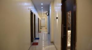 a hallway in a building with at Tokyo Inn in Howrah