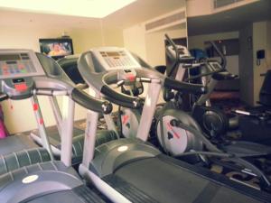 a gym with several exercise bikes in a room at Park Prime Kolkata in Kolkata