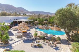 an aerial view of a resort with a pool and umbrellas at Boutique Hotel Onira in Parikia