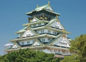 a large white building with trees in front of it at Noku Osaka in Osaka