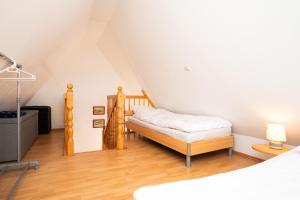 a bedroom with a bed in a attic at Alte Scheune Koserow bei Baltic Home in Koserow