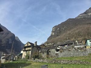 an old building in a village in the mountains at Casa Chiara in Cavergno