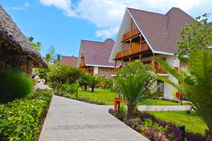 a resort building with a pathway leading to it at JAZ Amaluna - Adults Friendly 16 Years Plus in Uroa