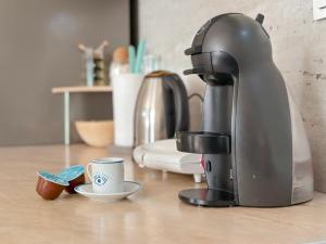 a coffee maker sitting on top of a counter at Siera's Penthouse in Prishtinë