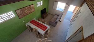 an overhead view of a room with a bed and a couch at Recanto do Pontal in Japaratinga
