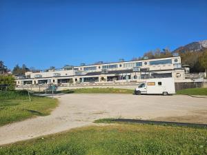 a white van parked in front of a building at Studio 2 étoiles proche thermes avec parking in Aix-les-Bains +4 photos