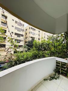 a balcony with a view of a building at Maya Eco Guest House in Dhaka