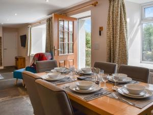 a dining room with a table and chairs at Uk47757 - Rose Cottage in Launceston +19 photos