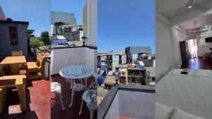 a balcony with a table and a view of a city at Aliya Stay in Galle +9 photos