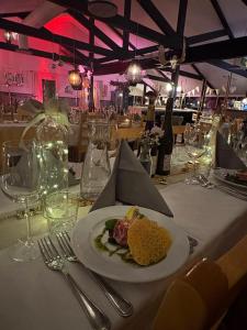 a plate of food on a table in a restaurant at Gesundaberget Lodge & Parstugor in Gesunda