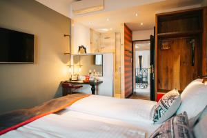 Postel nebo postele na pokoji v ubytování PEST-BUDA Design Hotel