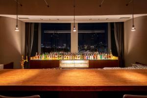 a bar with a view of a city at Hotel Grand Arc Hanzomon in Tokyo