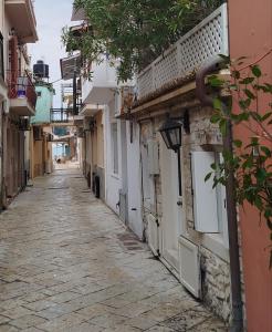 an empty street in an old town at Casa del porto in Lákka