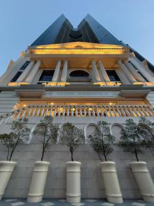 a building with trees in front of it at Parksuites Tower 2 in Manila