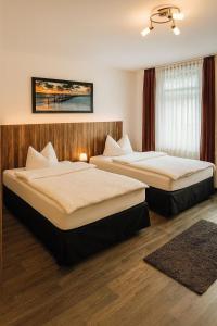 Un pat sau paturi într-o cameră la Charming Homes - Gästehaus Karin