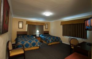Un pat sau paturi într-o cameră la King Motel - Miami