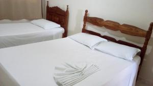 Giường trong phòng chung tại Hotel JB