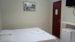 Giường trong phòng chung tại Hotel JB