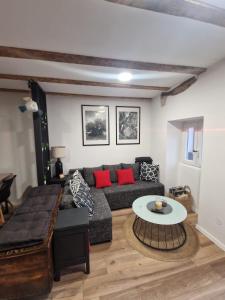 a living room with a couch and a table at Apartman Mocic in Punat