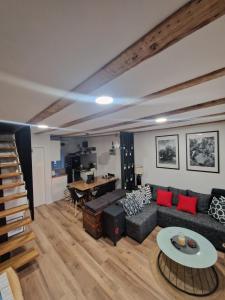 a living room with a couch and a table at Apartman Mocic in Punat