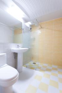 a bathroom with a toilet and a sink and a shower at Uniqstay in Busan +20 photos