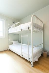 a bedroom with two bunk beds in a room at Uniqstay in Busan