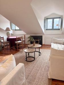 a living room with a couch and a table at La ventanuca del Valle in Bielva