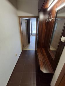 a hallway leading into a room with a mirror at Apartmán PRAHA in Martin