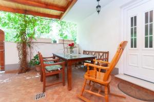 a dining room with a table and two chairs at Holiday House Therapy in Omiš +14 photos