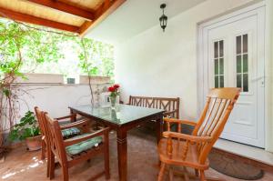 a dining room with a table and two chairs at Holiday House Therapy in Omiš