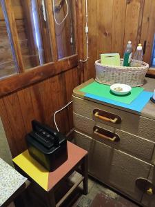 a table with a briefcase on top of a dresser at Chata - Na samotě u lesa in Levín +34 photos