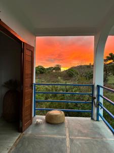 an open door with a view of a sunset at Le petit Relais 1 in Andilana