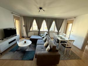 a living room with a couch and a table at Apartments Krug in Budva