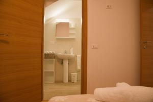 a bathroom with a sink and a mirror at La Ruelle in Sulmona +25 photos