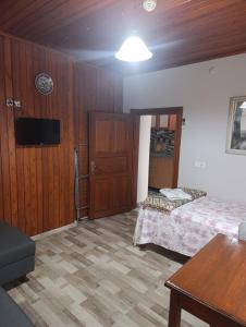 a room with two beds and a flat screen tv at Camel Apartment in Antalya