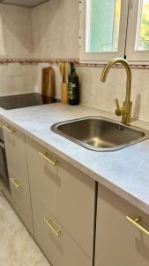 a kitchen with a sink and a counter at Casa Verde 56 in Cumbre del Sol