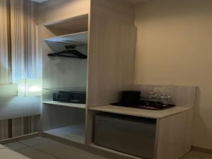 a small kitchen with a counter in a room at My Hotel @ Sentral in Kuala Lumpur