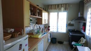 a kitchen with a counter and a sink and a window at ST MARTIN PLAGE in Saint-Martin-Plage +28 photos
