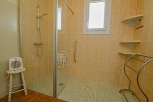 a shower with a glass door in a bathroom at Le marguette in Poivres +10 photos