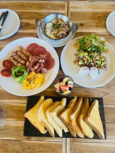 a table with four plates of food on it at Tuyo Homestay in Ban Pang Kiang +16 photos