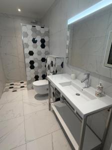 a bathroom with a sink and a toilet and a mirror at Kyrn Flor - Domaine Sant Antone in Corte +39 photos