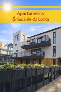 a collage of a picture of a building with plants at Apartamenty Śniadanie do Łóżka in Pobierowo
