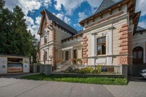 a large white house with at Penzion Vila Machů in Kopřivnice