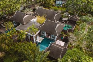 an aerial view of a villa with a swimming pool at Anantara Mai Khao Phuket Villas in Mai Khao Beach
