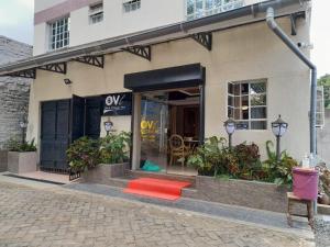 a store front with a red rug in the window at Ohm Village Inn in Kitui