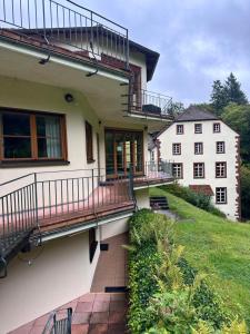 a house with balconies on the side of it at Neumühle Saar in Mettlach